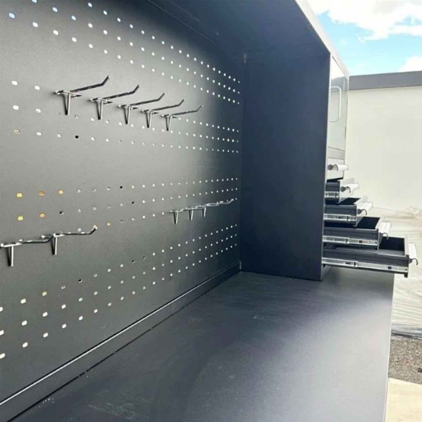 10' Garage Storage cabinet features a pegboard with hooks
