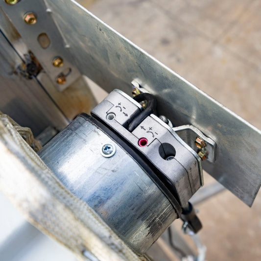 Close-up of a metal mechanism with wiring and connectors on a blurred background#Operation Type_Electric 110V Motor
