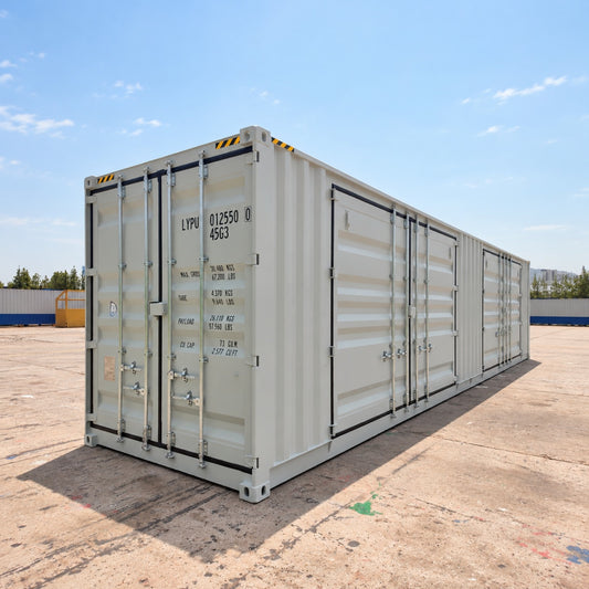 The shipping container has multiple doors, metal hinges, and printed shipping markings on the front door.