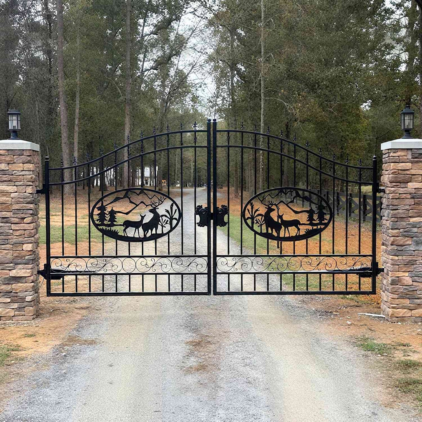 The deer pattern driveway gate is used in a forest.