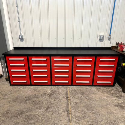 Red tool cabinet with multiple drawers in a garage setting#color_red