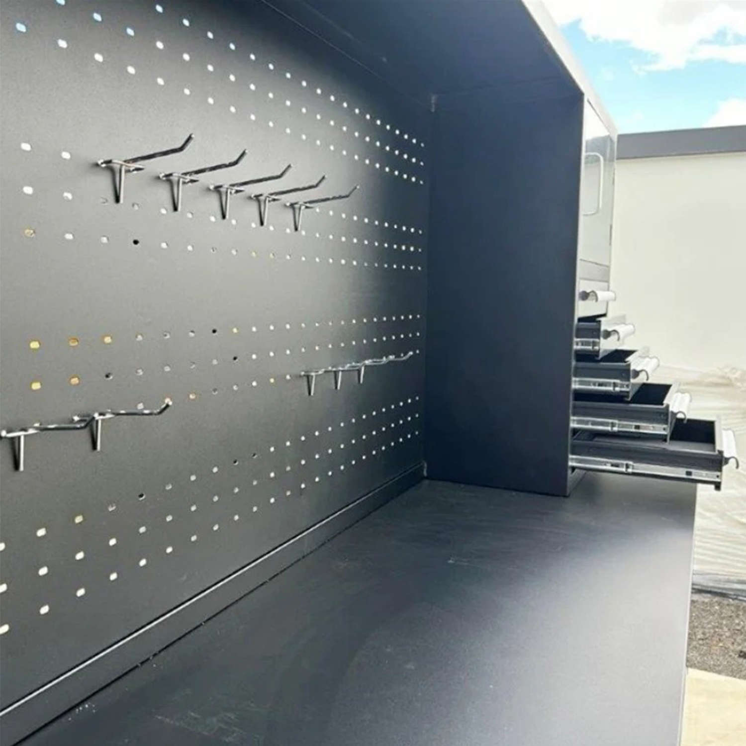 10' Garage Storage cabinet features a pegboard with hooks