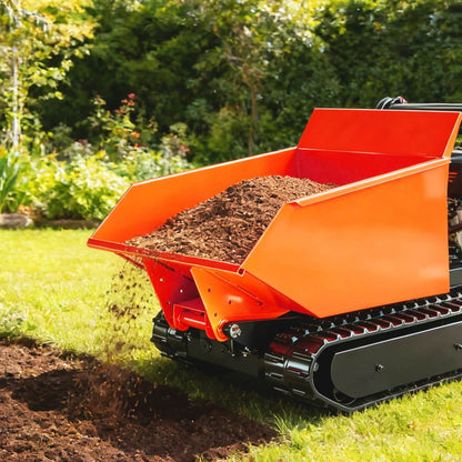 Orange tracked machine with a dump bed filled with soil, on grass with greenery in the background