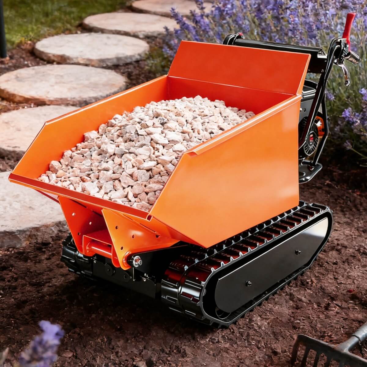 Small orange Track Mini Dumper with a bed full of stones on a garden path.