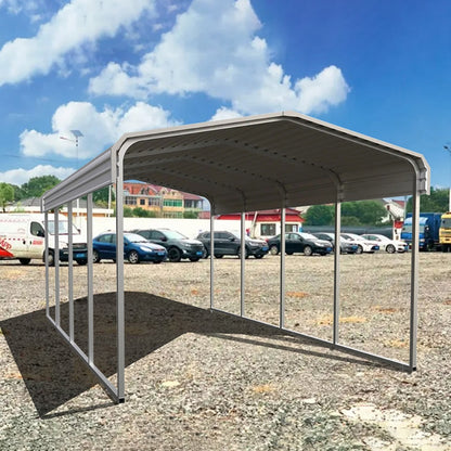 Metal carport structure in an outdoor setting with vehicles in the background