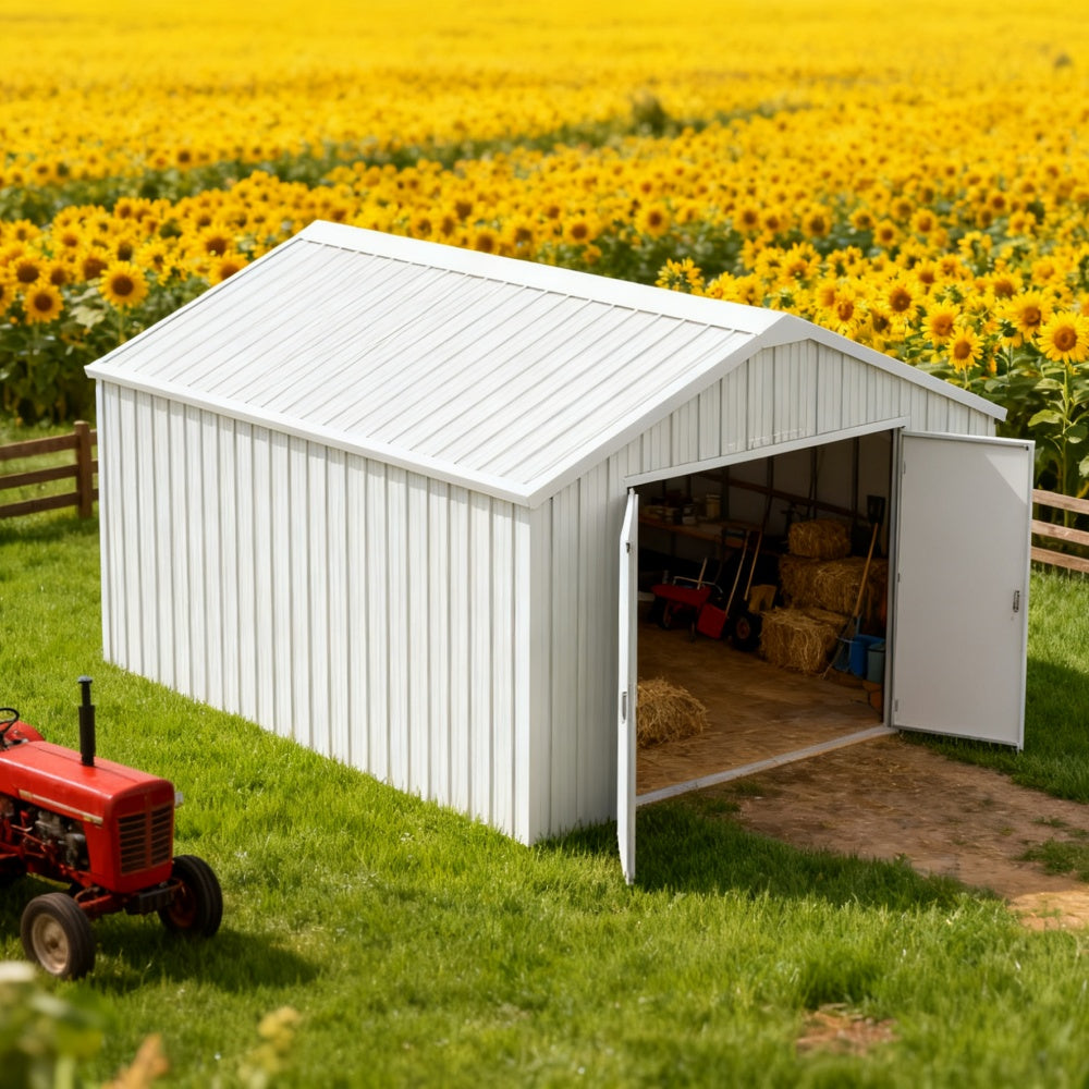 White storage shed with open door in a field of sunflowers, red tractor nearby.