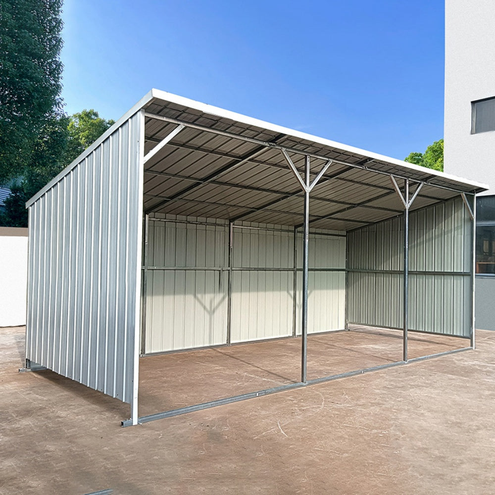 Metal carport structure with a clear sky background