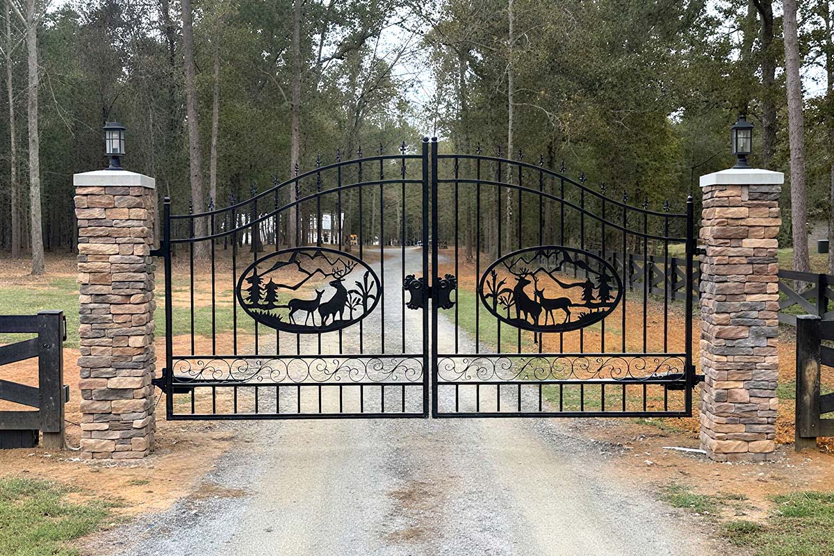 14 ft Deer Pattern Driveway Gate in a Forest