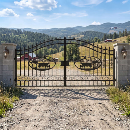 A large black wrought-iron double gate with decorative cow and mountain motifs