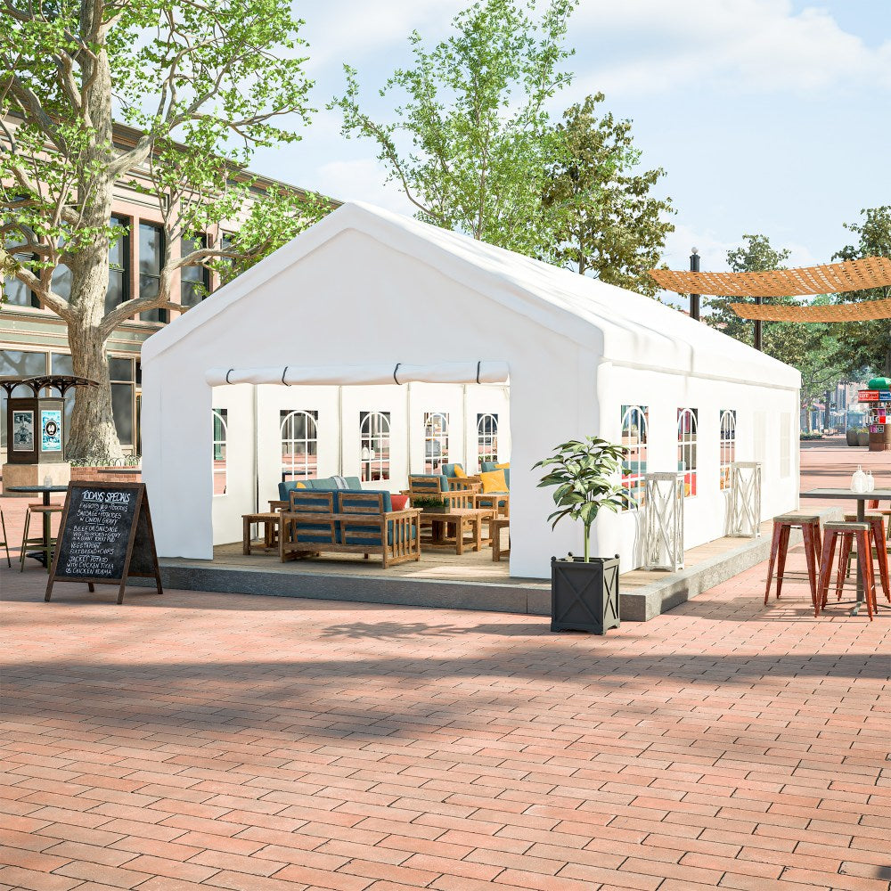 White tent with outdoor furniture on a brick pavement