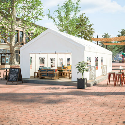 White tent with outdoor furniture on a brick pavement