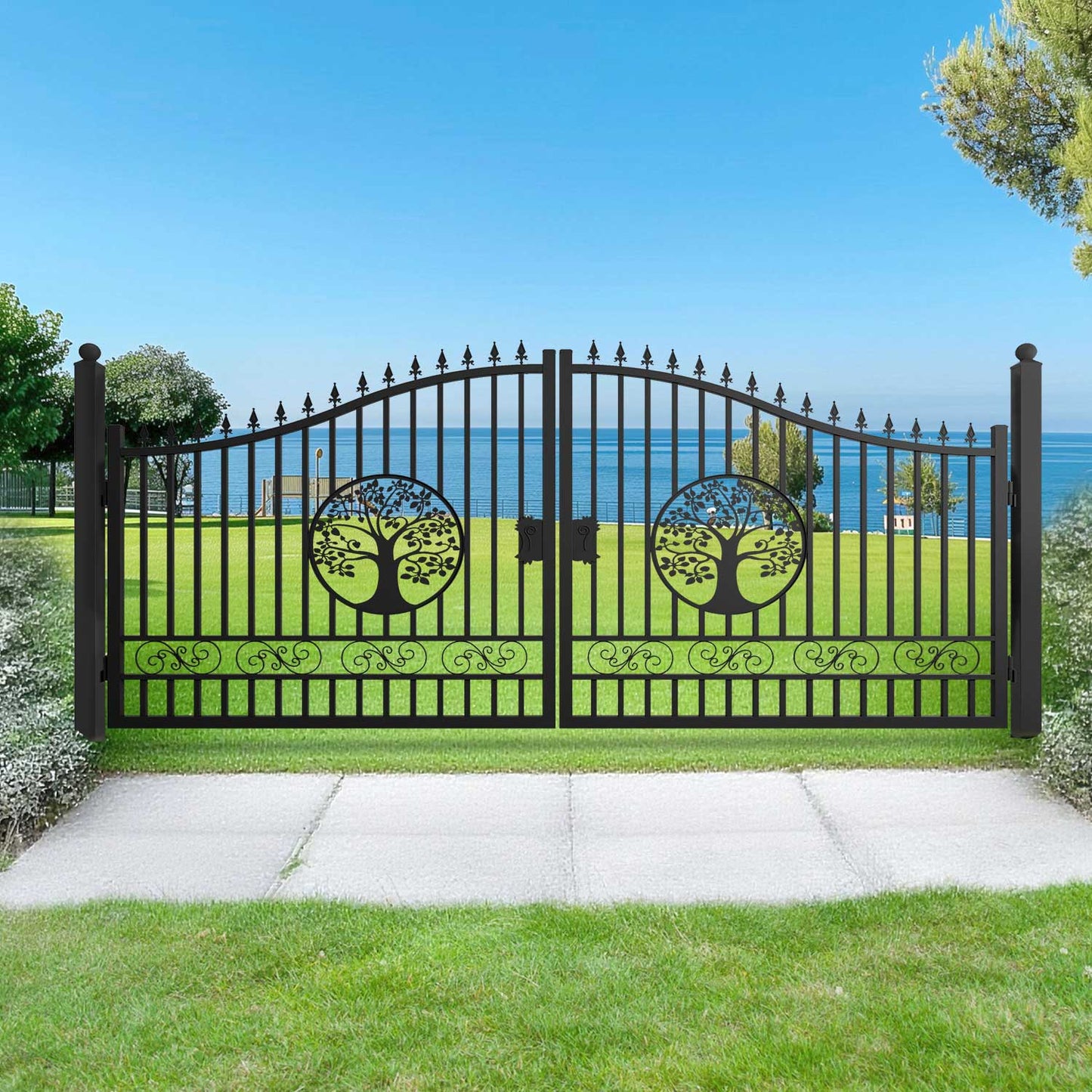16ft driveway gate with tree pattern in a garden setting with ocean view