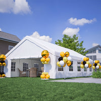 White party tent with decorative balloons and chairs on a grassy area.