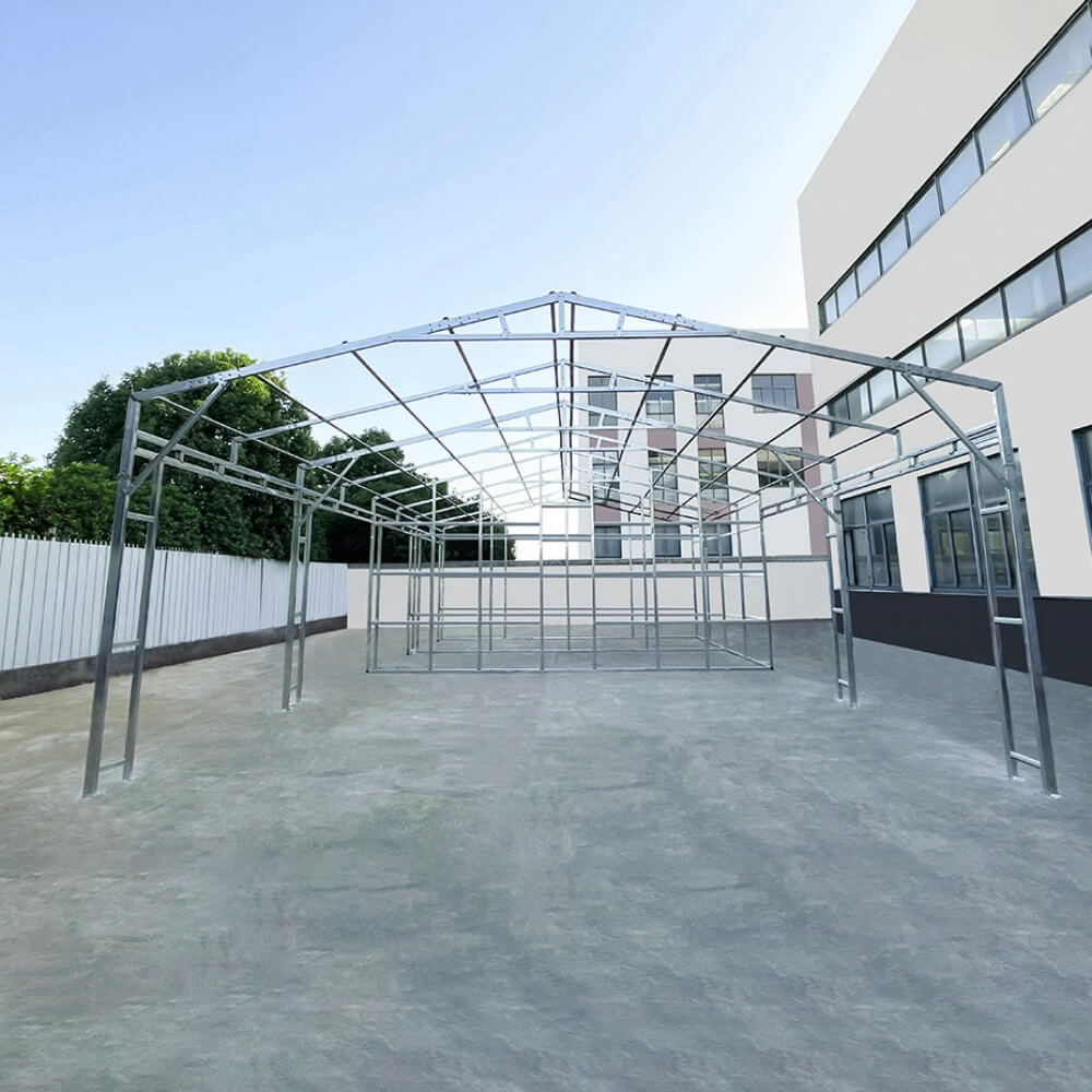Metal frame structure on a concrete surface with a building in the background#color_White
