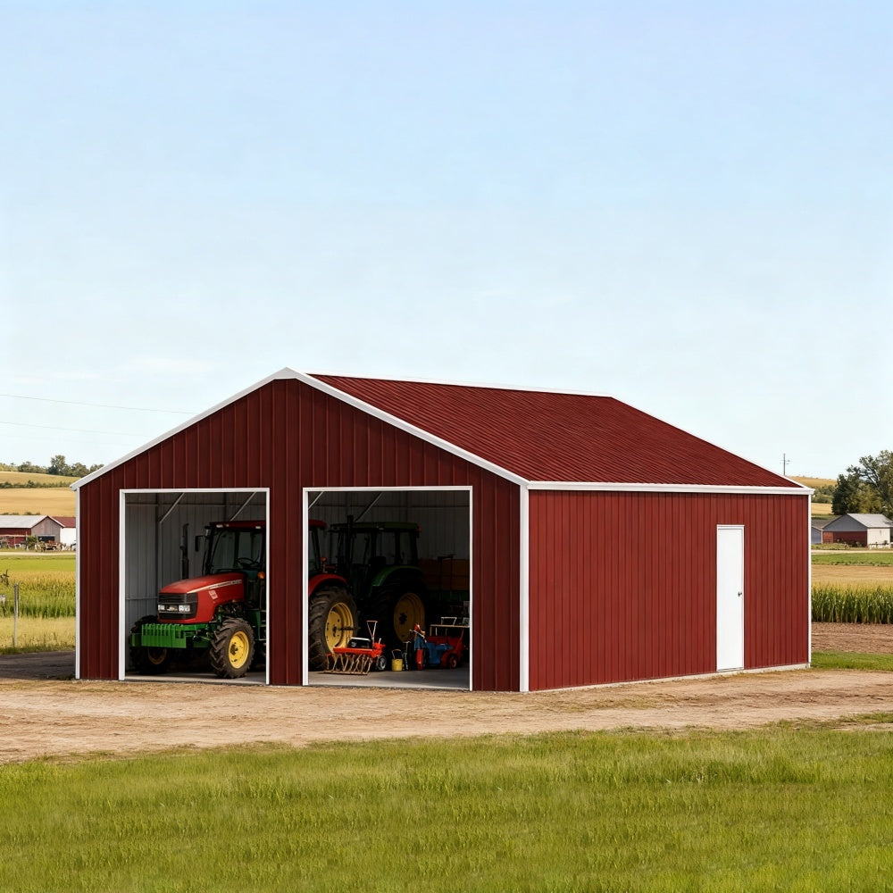 Red metal barn with open doors showing tractors and farm equipment on a clear day.