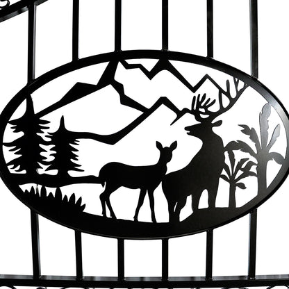 Black metal decorative gate sign featuring a silhouetted oval landscape with mountains, trees, and two deer