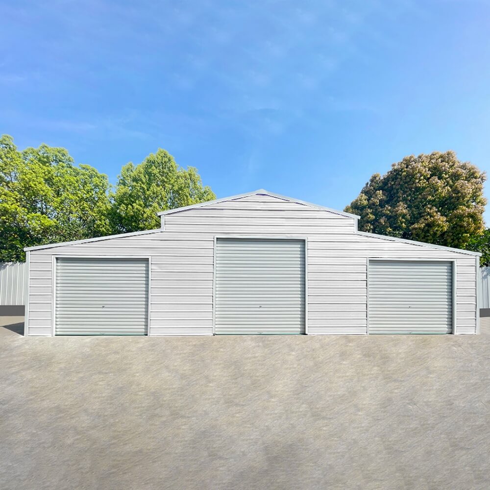 White storage shed with three garage doors against a blue sky#color_White