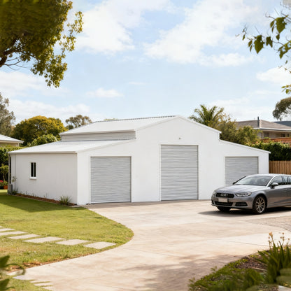 White garage with three roller doors, car parked outside on a sunny day.#color_White