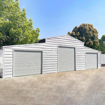 Metal storage shed with three garage doors in a residential setting with trees and clear sky.#color_White