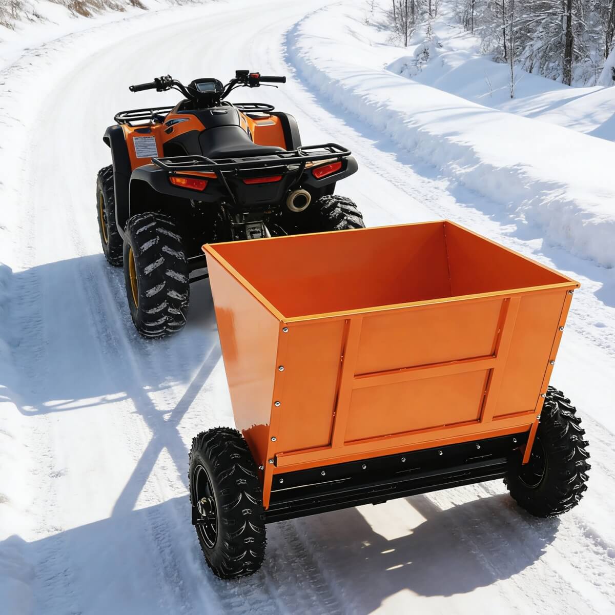 Orange dump cart being pulled by an ATV on a snowy trail