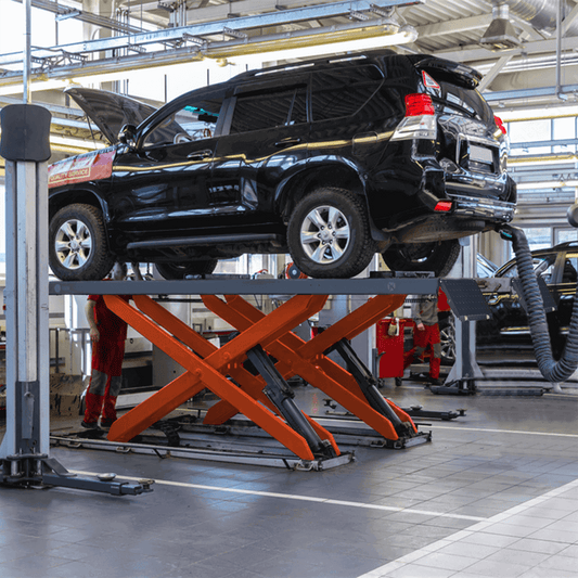 KT-X85 Mid-rise Scissor Lift is lifting a black car