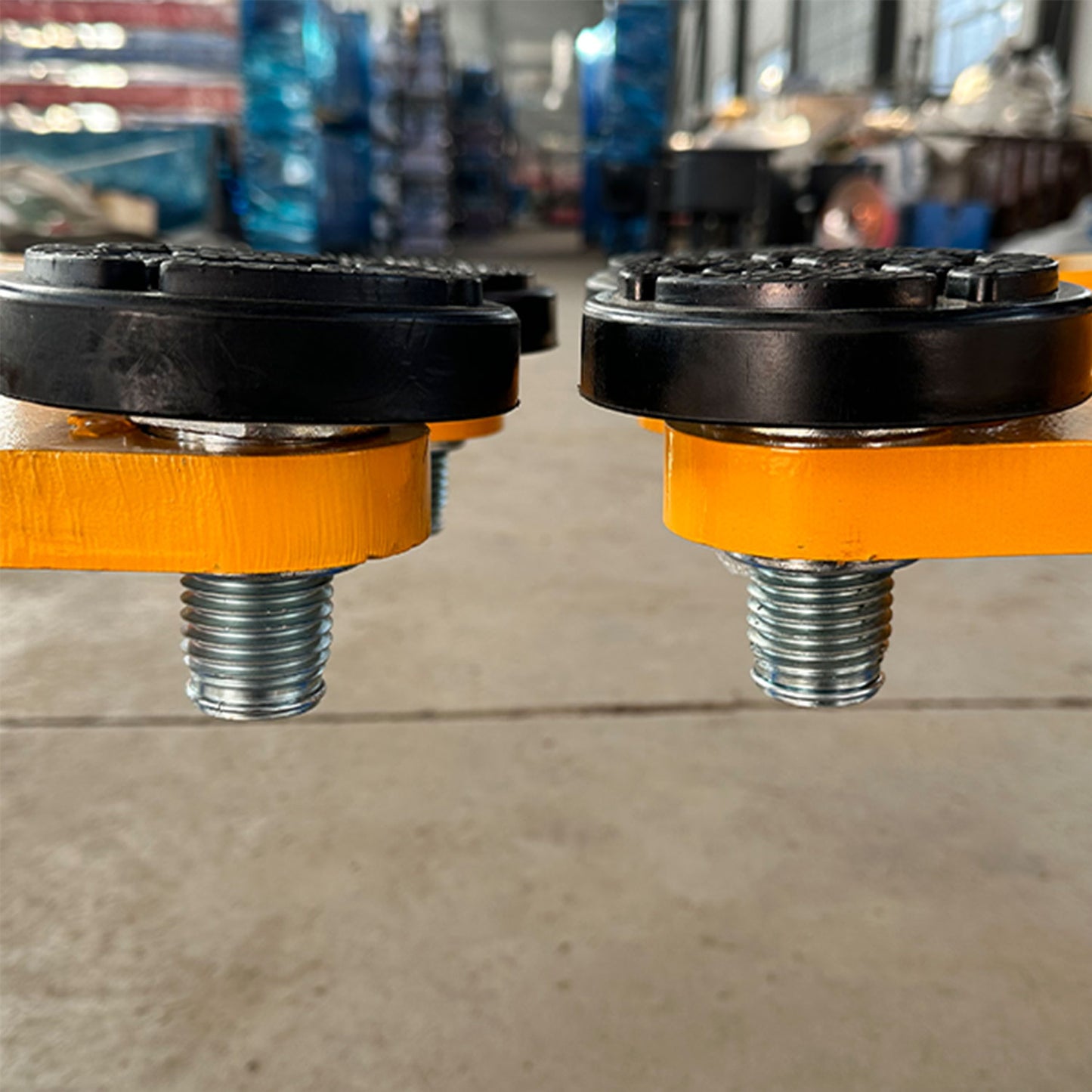 The car lift features rubber contact pads