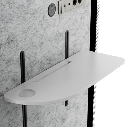 Gray wall-mounted shower seat with black brackets against a gray marble wall.