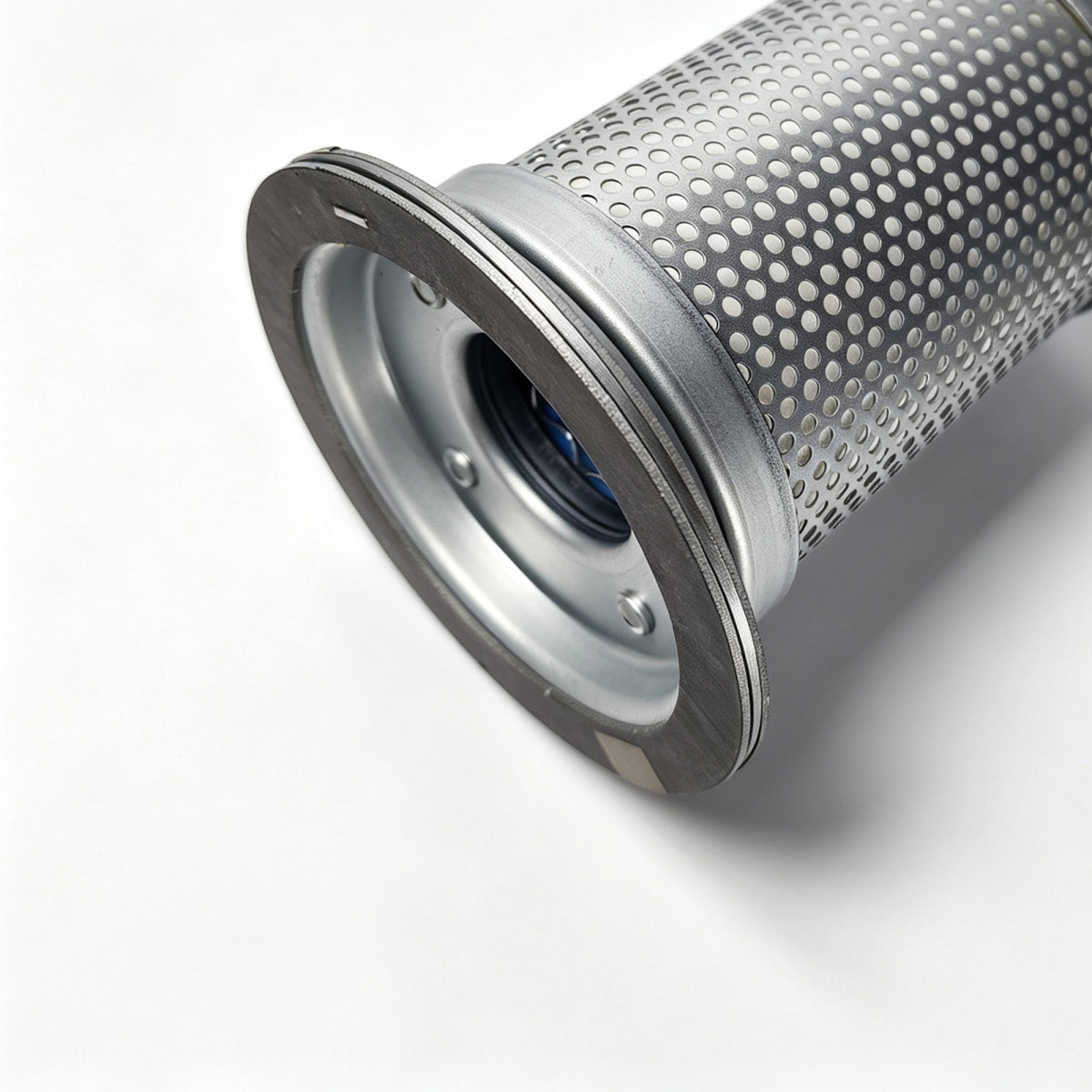 A close-up of a cylindrical metal filter element with a perforated outer surface, a flanged silver end