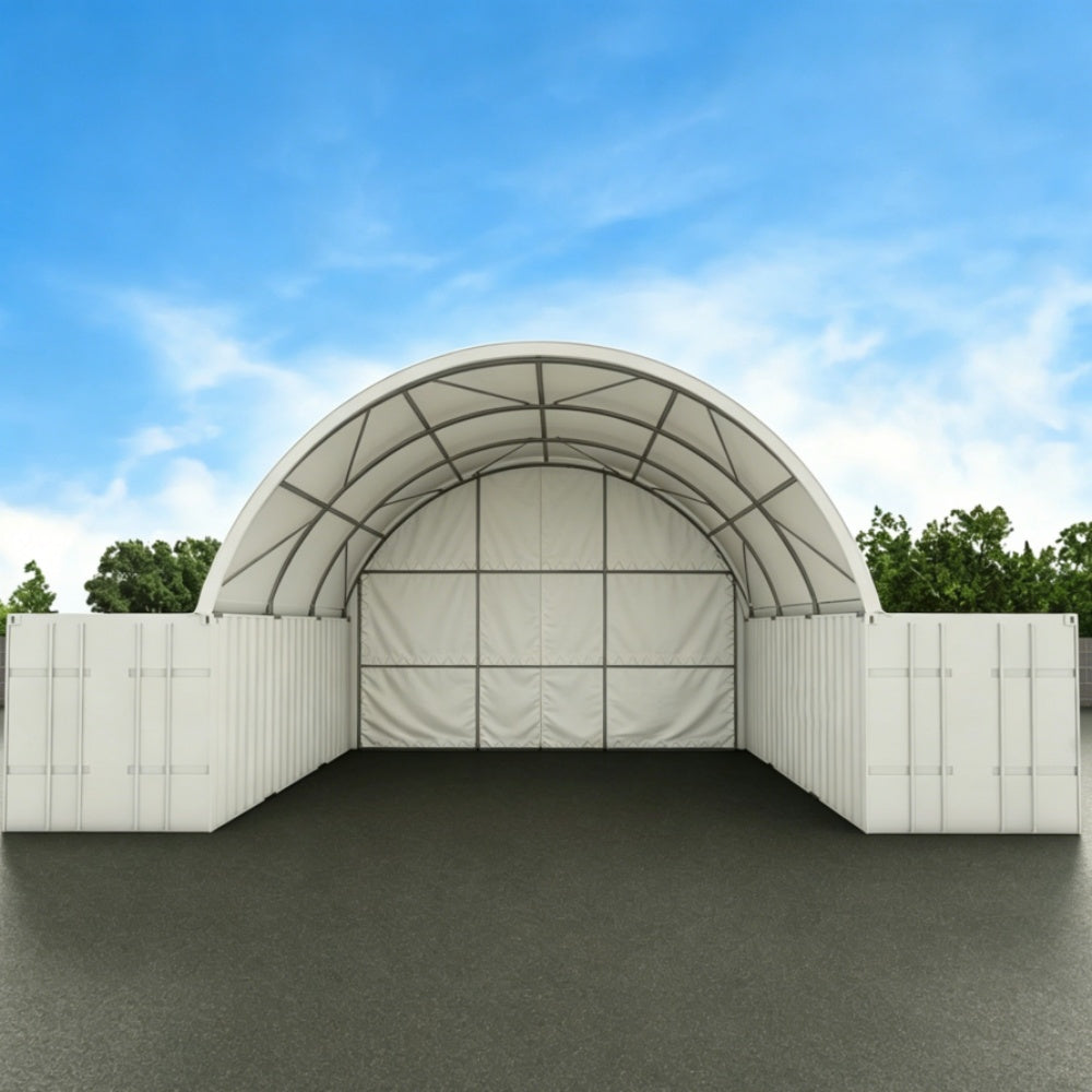 Arch-shaped storage building with white walls and a blue sky background